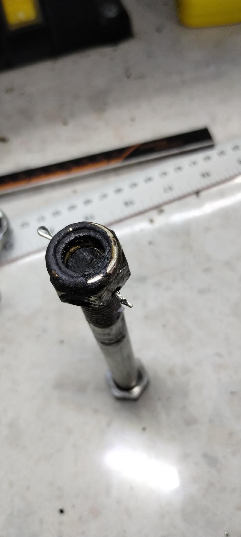 M12 nyloc nut with metal thread exposed